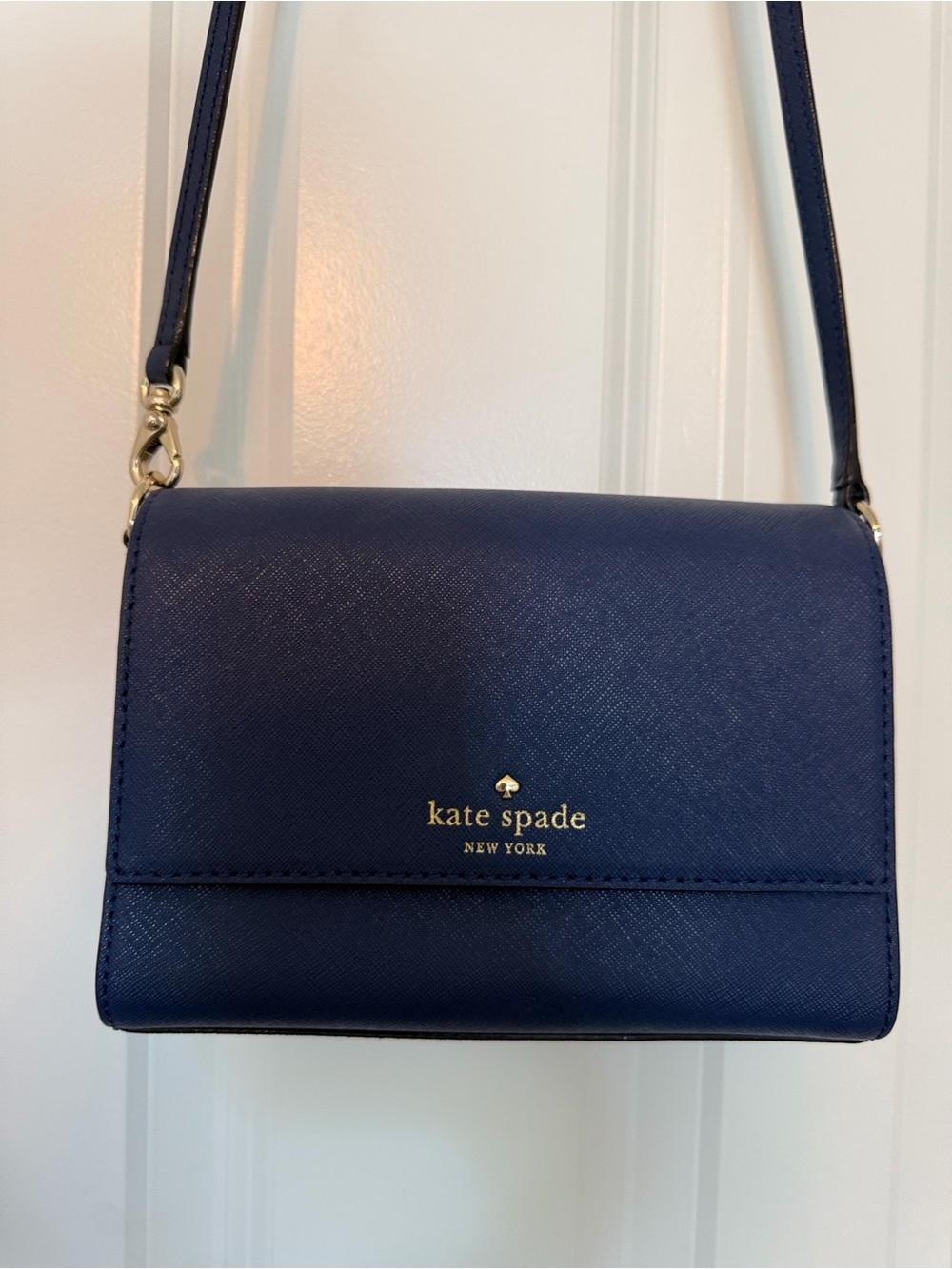 kate spade navy blue saffiano crossbody with gold logo